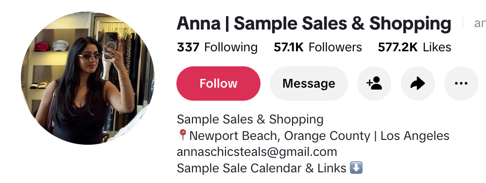 Anna, a sample-sale and deal-finding creator, posing with fashion purchases in a lively retail setting.