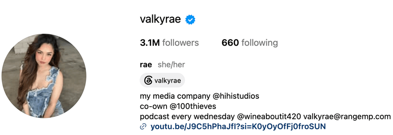 Valkyrae, a gaming and lifestyle creator, posing in a polished portrait with a confident, fashion-forward tone.