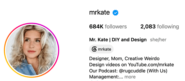 Mr. Kate creators Kate Albrecht and Joey Zehr posing together in a bold, artfully designed interior.