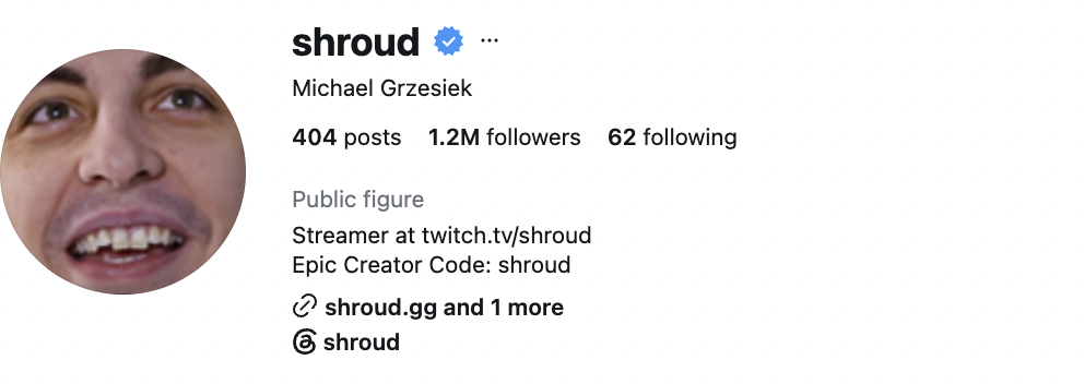 Shroud, a competitive gaming creator, seated at a minimalist gaming station with a composed and professional expression.